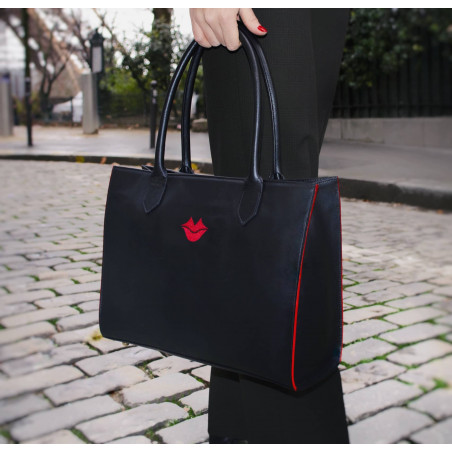 Black PARIS soft leather tote bag with red embroidered mouth and borders, lifestyle view 2 |Gloria Balensi