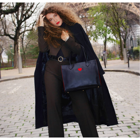 Black PARIS soft leather tote bag with red embroidered mouth and borders, lifestyle view 3 |Gloria Balensi
