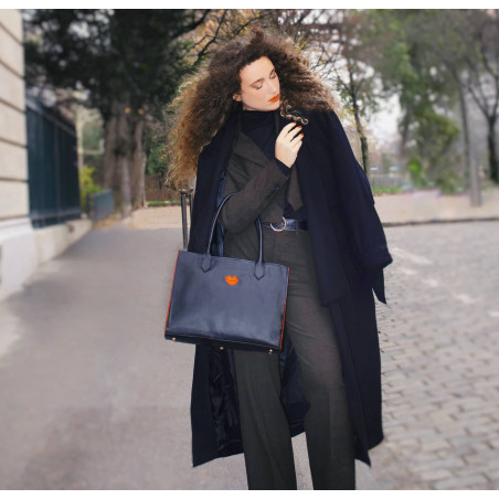 Black PARIS soft leather tote bag with oranges embroidered mouth and borders, lifestyle view 1|Gloria Balensi