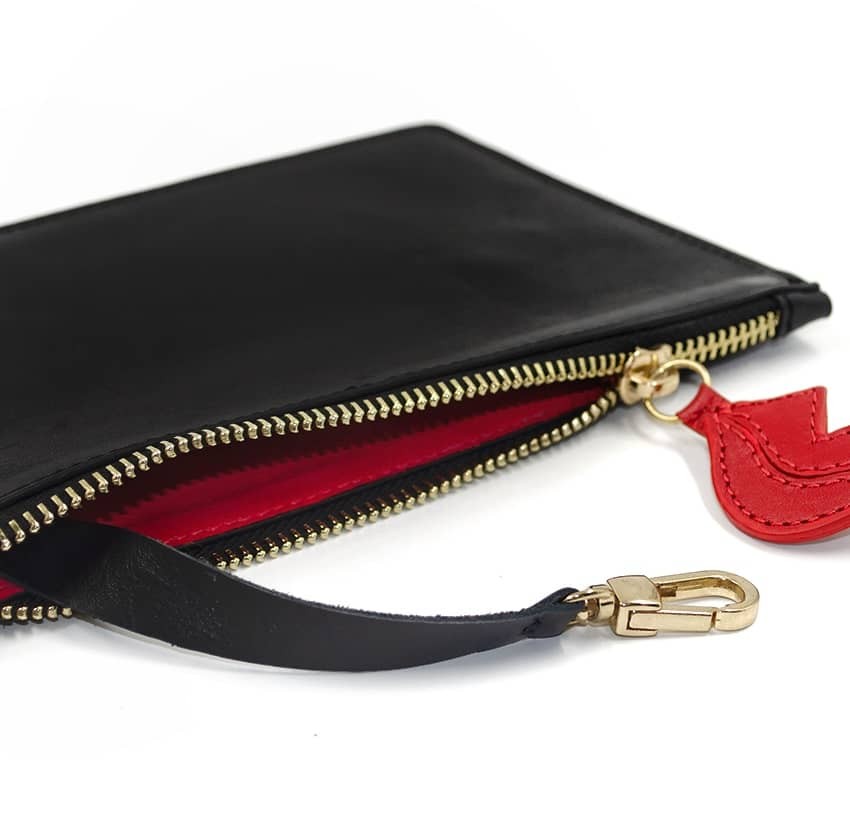 Black leather Zipped pouch ISADORA, red mouth , lying view  | Gloria Balensi